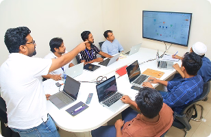 Jouleslabs CTO and Co-Founder Nahid Bin Azhar leading a technical session on production-grade SaaS architecture and AI development strategies with the engineering team.