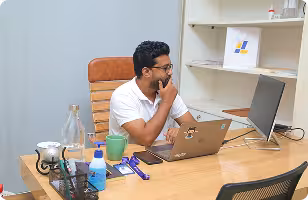 Jouleslabs Co-Founder Nahid Bin Azhar working on scalable SaaS and AI solutions in a professional office setting.